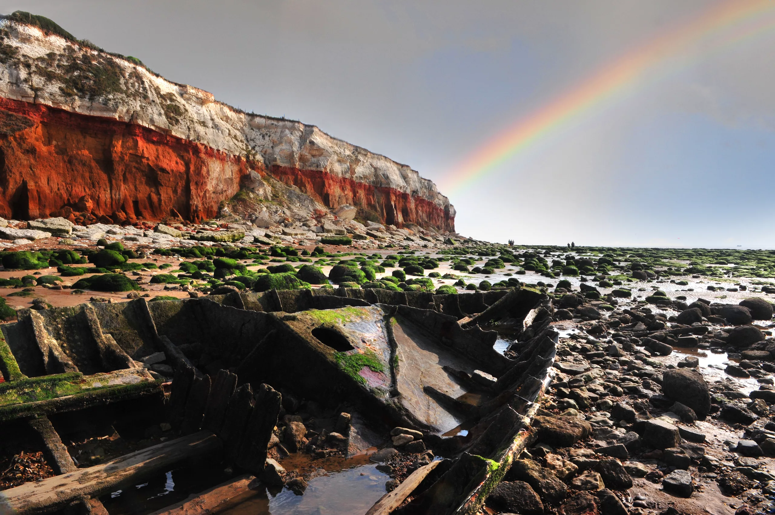 The remnants of a boat at low tide on Hunstanton beach