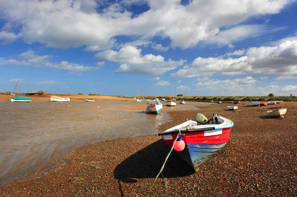 Boats moored at low tide