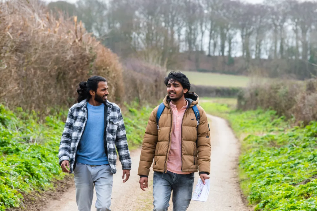 Two men walking down a country lane